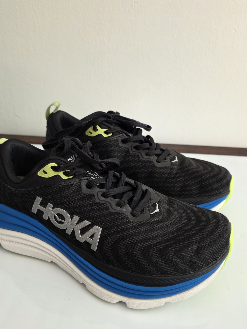 HOKA One One Gaviota Black Running Shoes with Blue & Lime Accents.